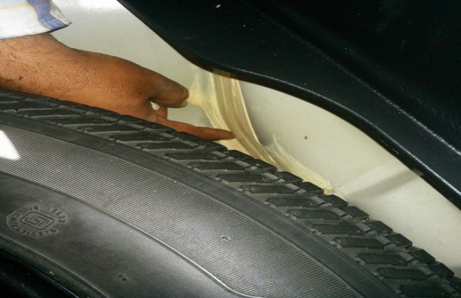 Check pasting under the spare wheel